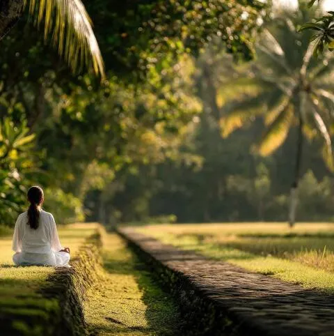 A women meditating in a garden